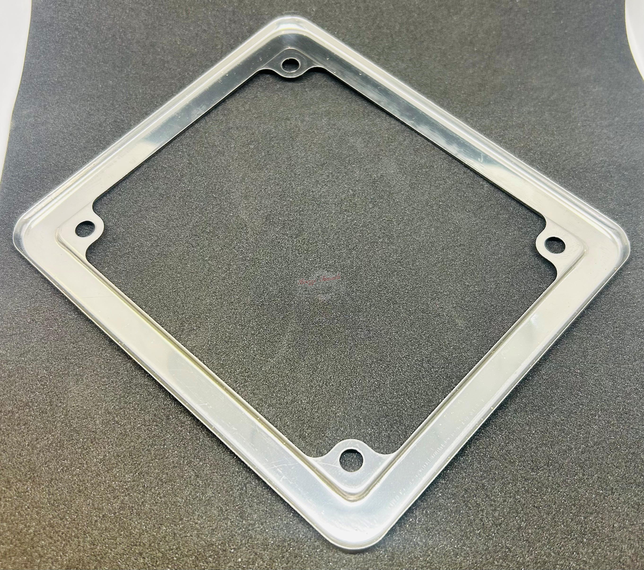 CORNICE TARGA CICLOMOTITI 50 CC MISURE 150 X 130 MM INTERSASSE 115 X 95 MM CROMATA